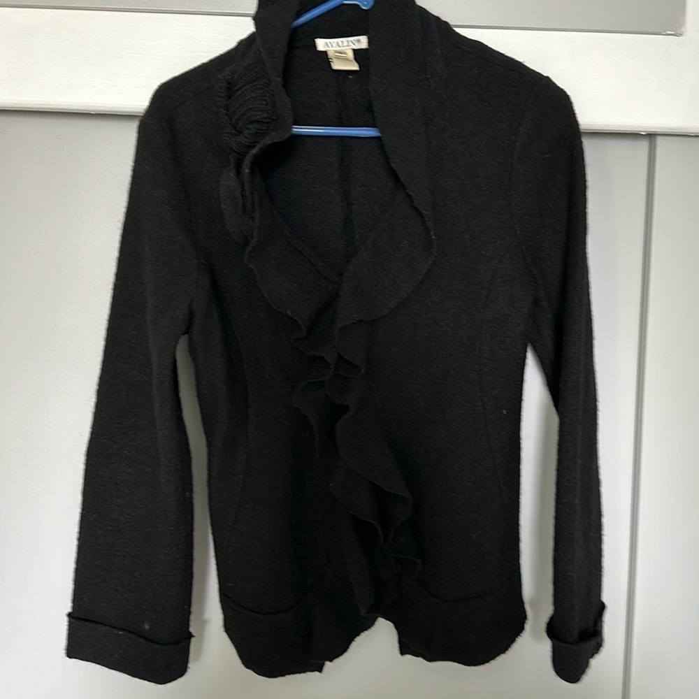 This is a decorative 100 % wool jacket with flowers.